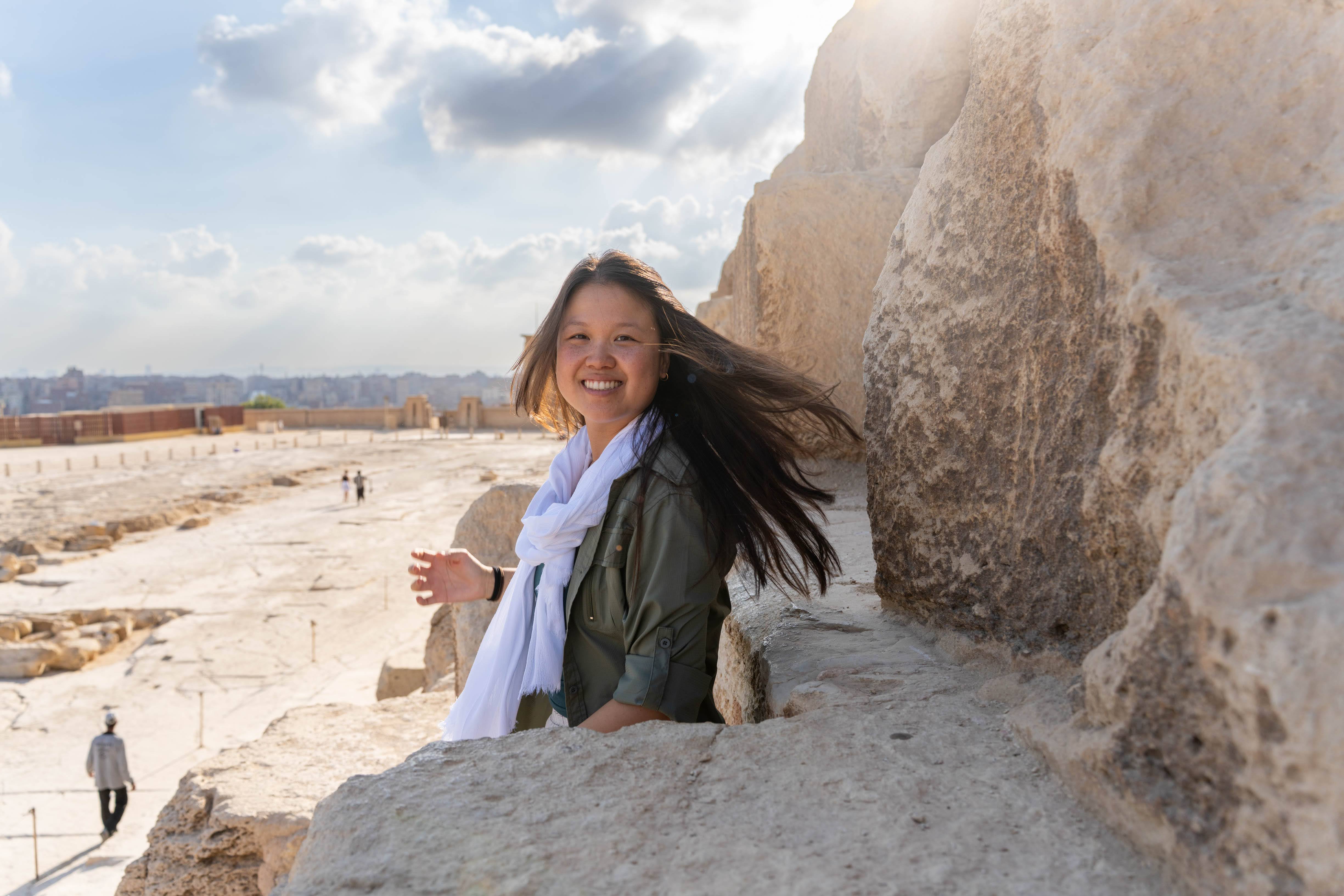 Kim posing next to the pyramids