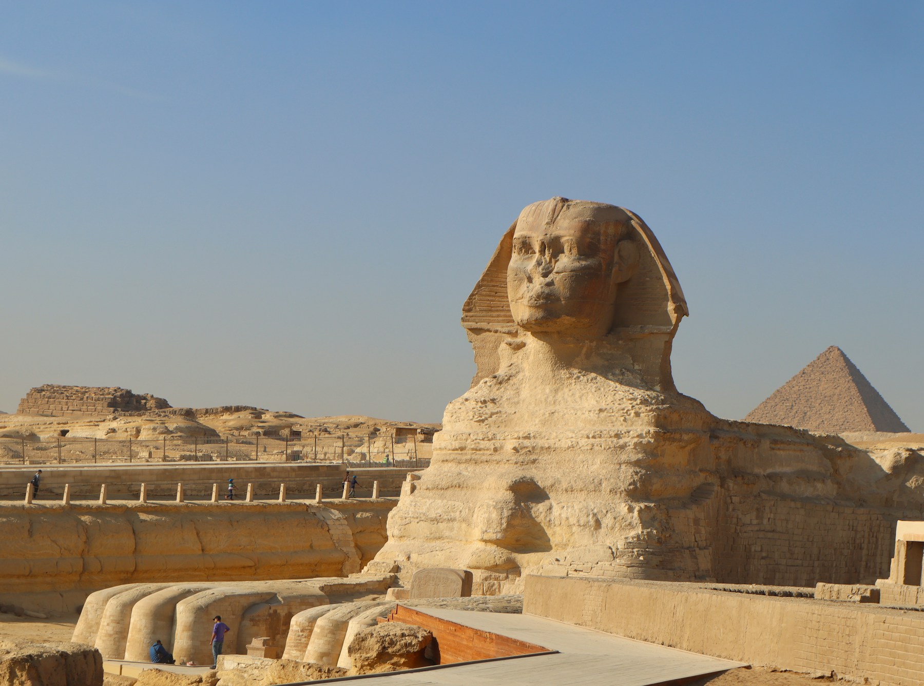 The Sphinx and pyramid beneath a clear Egyptian sky